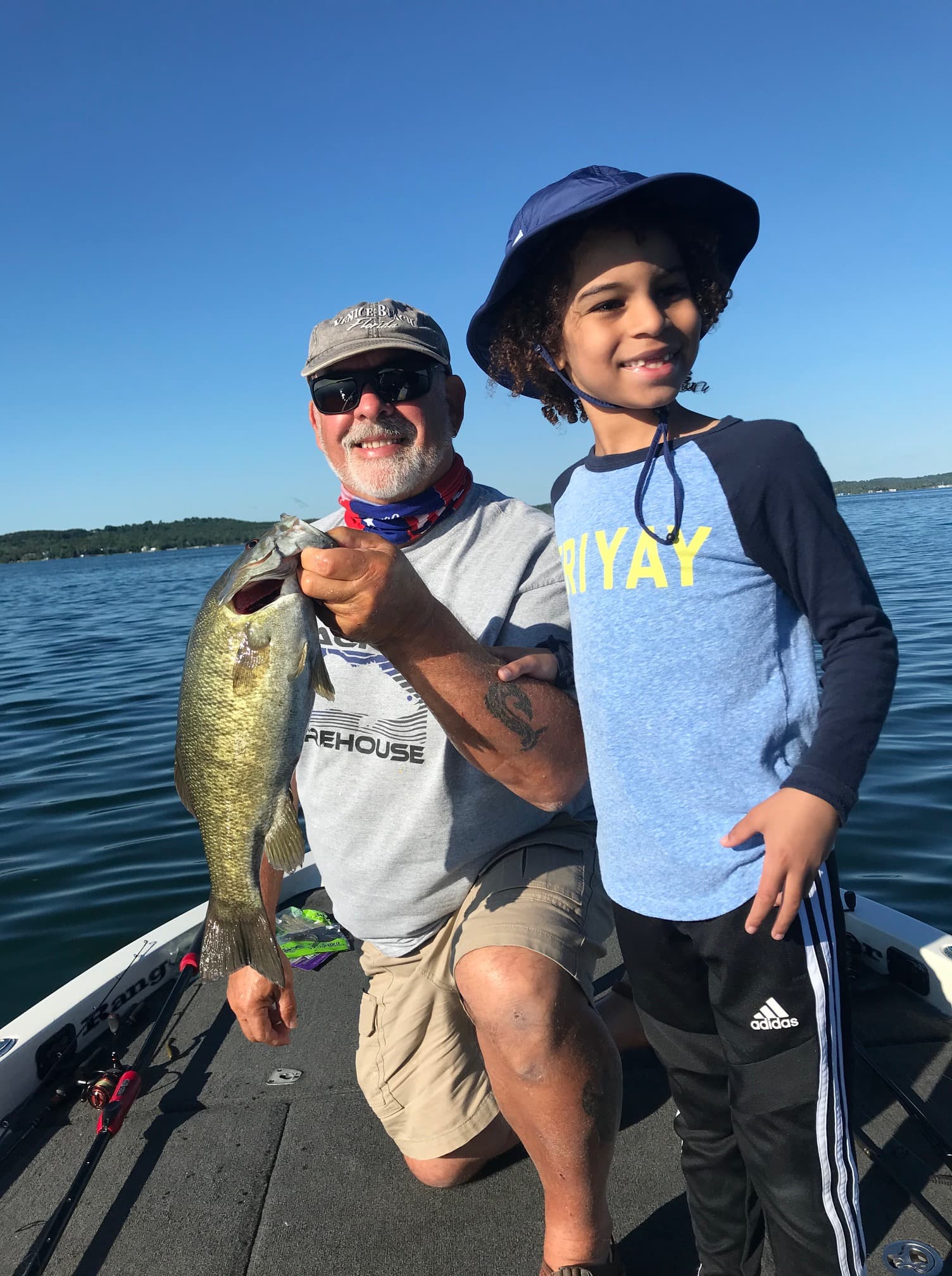 Captain with young angler and catch